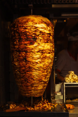 Close-up of meat on a kebab spitの写真素材