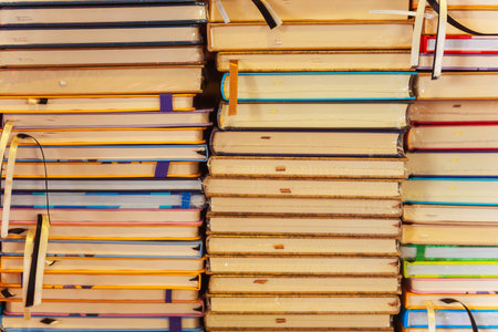 Stack of notebooks and books close -upの写真素材