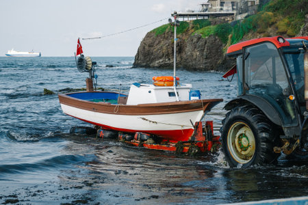 unloading the boat on the shore. pulling the boat to the beach for repairs