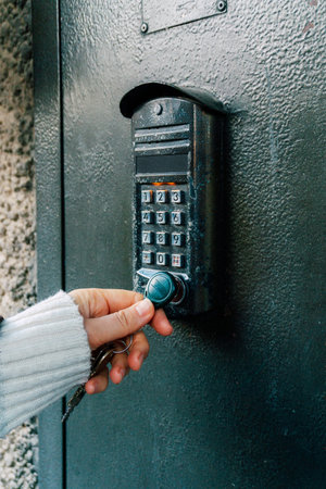 Magnetic intercom in an apartment building. Opening the front door lock with a magnet