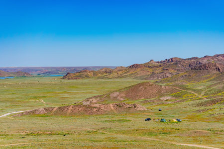An off-road tourist trip to the mountains of Almaty. picnic on four-wheel drive cars in the steppeの写真素材