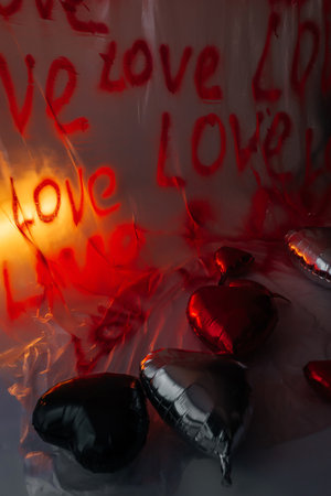 foil heart shaped balloons on white floor. photo zone for love day in photo studioの写真素材