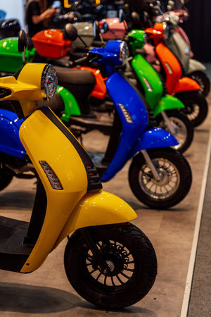 small-capacity scooters at a motorcycle exhibition. colorful scooters for the standの写真素材