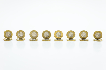 Standing coins, the Polish currency PLN 2 / Polish zloty. Isolated on white background with clipping path (without a shadow).の写真素材