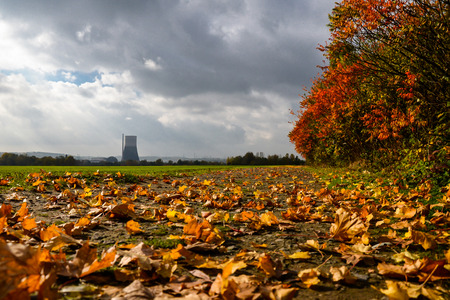 The chimney of the nuclear power plant is visible on cloudy windy dayの写真素材