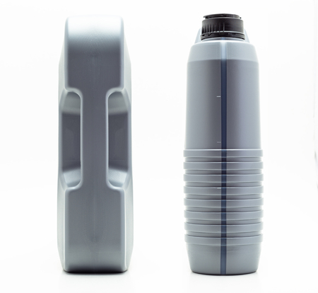 Gray, plastic motor oil container with a capacity of five liters. Isolated on a white backgroundの写真素材