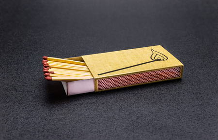 Long matches lying on a black background, with a clipping path.