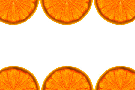 Frame made from fresh grapefruit on a white background with copy space in the middle. Overhead view,...
