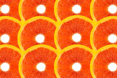 Pattern made from fresh grapefruit on white background, overhead view, flatlay. Fruit background.