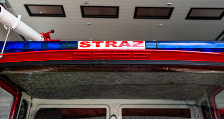 Blue warning signals placed on the roof in a fire truck with the Polish inscription