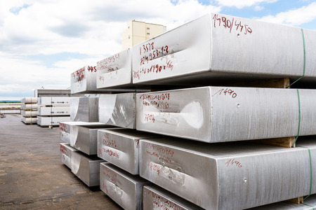 Heavy aluminum bars lying down on a smelter.の写真素材