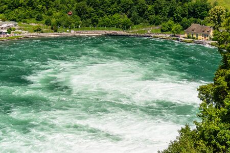 Neuhausen am Rheinfall, Switzerland - 23 July 2019. Waterfall on the river Rhine in the city of Neuhausen am Rheinfall, Schaffhausen in northern Switzerland. The Rhine Falls is the largest waterfall in Europe.のeditorial素材