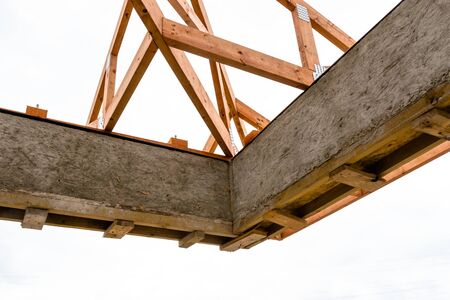 Roof trusses not covered with ceramic tile on a detached house under construction, visible roof elements, battens, counter battens, rafters.の写真素材