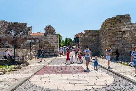 Nessebar, Bulgaria July 15, 2019. A crowd of people walking around the ancient and historic city of...
