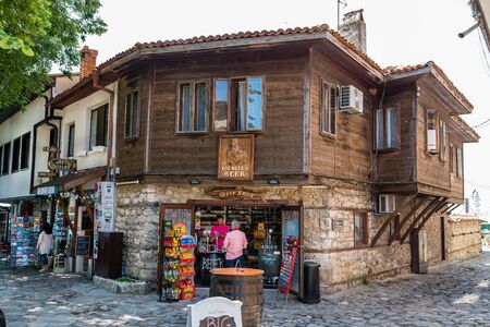 Nessebar, Bulgaria July 15, 2019.Historic buildings in the ancient city of Nessebar in Bulgaria.Nessebar is an ancient city-museum, more than three millennia.Beer shop in a old wooden house.のeditorial素材