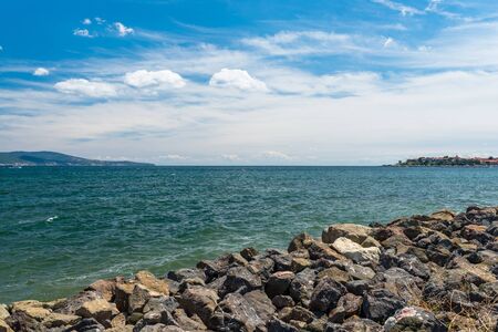 Rocky shore over the beautiful Black Sea, in Nessebar, Bulgaria. In the background a sky with...