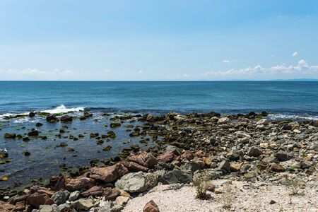 Rocky shore over the beautiful Black Sea, in Nessebar, Bulgaria. In the background a sky with...