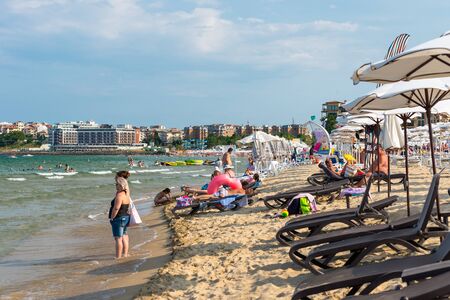 Sunny Beach, Bulgaria July 15, 2019. Crowd of tourists on the Black Sea beach, in Sunny Beach, Bulgaria, on a beautiful hot summer day.のeditorial素材