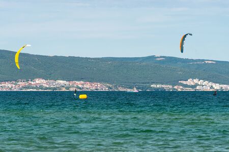 Sunny Beach, Bulgaria July 13, 2019. The man practices hydrofoil kitesurfing in the Black Sea off...