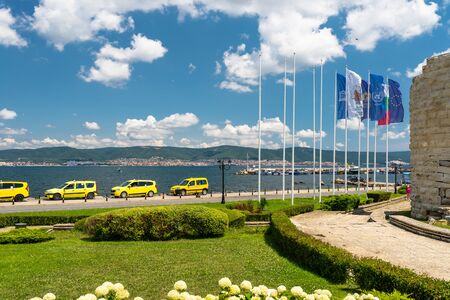 Nessebar, Bulgaria July 15, 2019. Large Bulgaria, European Union and Unesco flags hanging on a mast at the entrance to the historic city of Nessebar on the shores of the Black Sea in Bulgaria.のeditorial素材