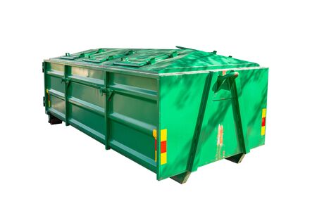 A large, metal, green garbage container and municipal waste, isolated on white background with clipping path.の写真素材
