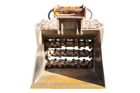 Excavator shovel with ground shredder, front view, isolated on a white background with a clipping...