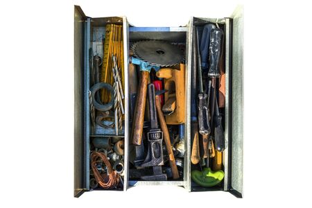 An open tool box with various old tools visible from above, isolated on a white background with a clipping path.の写真素材