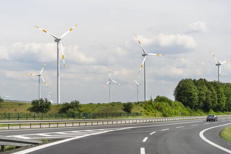 Bonn, Germany May 23, 2019. A windmill for electricity production standing in a field along the...