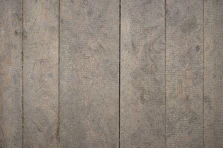 Texture made of wooden planks arranged vertically, visible connection between boards.