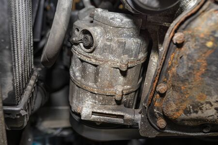 Air conditioning compressor in a passenger car seen from below.の写真素材