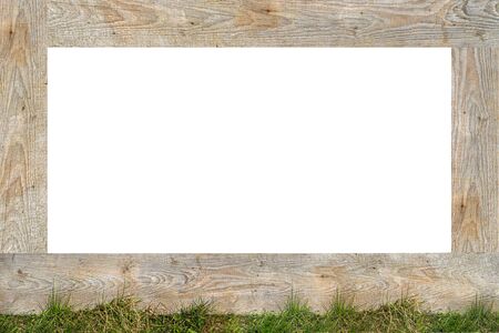 A frame made of real wooden boards, the bottom is covered with green grass and copy space in the...