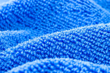 Background made of blue microfiber fabric, selective focus.の写真素材