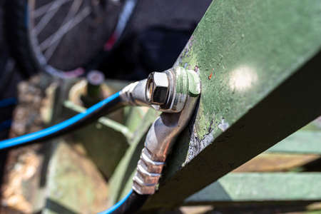 A grounding cable connecting the metal railings on the railway bridge.の写真素材