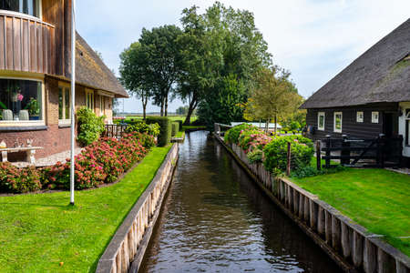 Giethoorn, Netherlands - 13 September 2020. Beautiful thatched buildings in the famous village of Giethoorn in the Netherlands with water canals. The village is called the Venice of the Netherlands.のeditorial素材