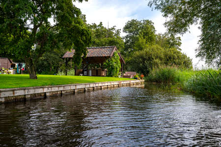 Giethoorn, Netherlands - 13 September 2020. Beautiful thatched buildings in the famous village of Giethoorn in the Netherlands with water canals. The village is called the Venice of the Netherlands.のeditorial素材