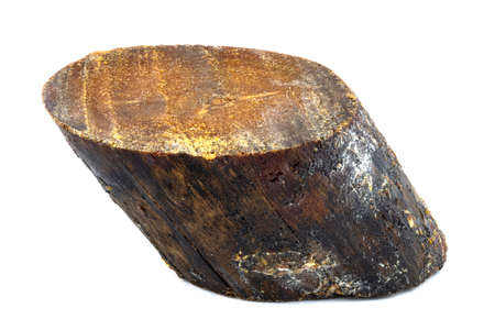 A macro shot of a wood knot covered with resin, isolated against a white background.