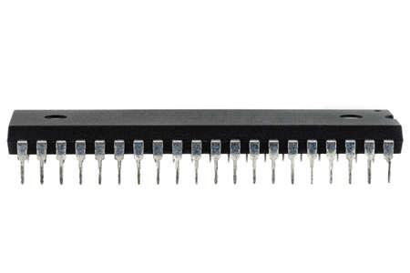 A macro shot of a DIP 40 pin computer microchip, isolated on a white background.