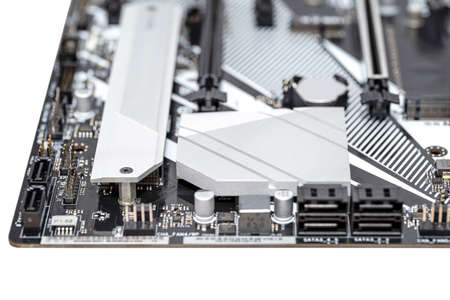 Macro shot of a silver heat sink dissipating heat from the chipset on the motherboard of a desktop computer.の写真素材