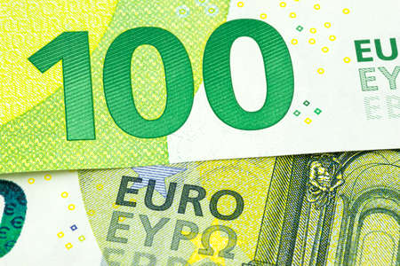 Macro shot of a European Union banknote of 100 EUR, close-up of the number one hundred, selective focus.の写真素材