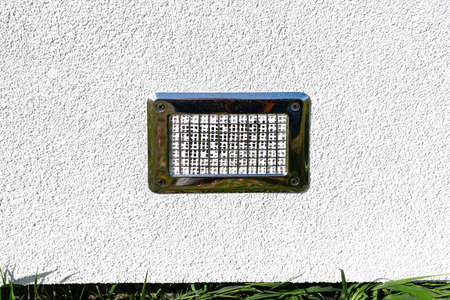 Air intake from the manor to the fireplace with a closed combustion chamber, silver grille on the...