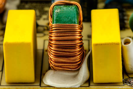 An inductor, toroidal coil on a ring with visible copper scroll, wound on a magnetic coil.の写真素材