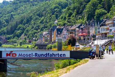 Cochem, Germany, June 13, 2021. Beautiful view of the colorful buildings along the river and the old town of Cochem on the Moselle in Rhineland-Palatinate, Germany.のeditorial素材