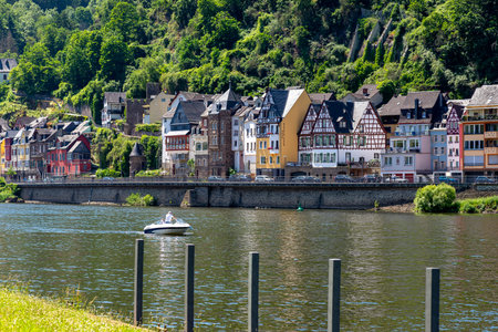 Cochem, Germany, June 13, 2021. Beautiful view of the colorful buildings along the river and the old...