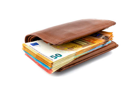 Brown leather mens wallet with a stack of Euro banknotes inside, isolated on a white background, 50...