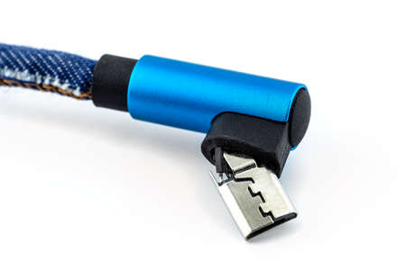 Macro shot of the blue damaged end of the USB 2.0 Micro-B cable, isolated on a white background.の写真素材