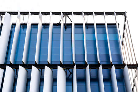 The facade of a modern building with an innovative facade made of automatic, movable blinds.