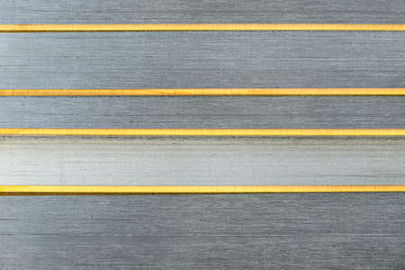 Background made from a macro photo of pile of razor blades with yellow blades, top view.の写真素材