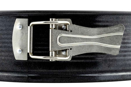 A macro photo of the metal clamp used to fasten a round baking sheet.