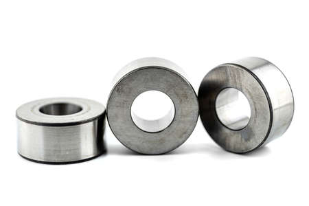 Photo of three roller sleeve for needle roller bearings, isolated on a white background.の写真素材