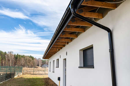 Roof trusses through which the electric cable passes to connect the lighting in the soffit.